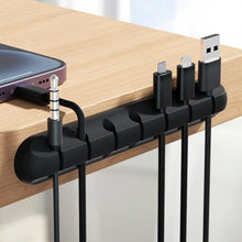 Заредете изображение във визуализатора на галерията – Blue Star PJ-OCZ8 silicone self-adhesive organizer for 7 cables - black (1 pc.)
