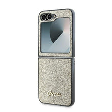 Заредете изображение във визуализатора на галерията – GUESS case for SAMSUNG Z Flip 6 GUHCZF6HGGSHD (HC PU 4G Glitter Script) gold
