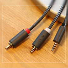 Заредете изображение във визуализатора на галерията – Ugreen AV102 10510 cable 3.5 mm mini jack (male) / 2RCA (male) 2m - gray
