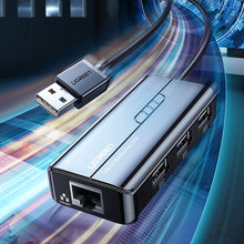 Заредете изображение във визуализатора на галерията – Ugreen 20264 RJ45 / USB-A 10/100Mbps HUB network adapter 3x USB-A 2.0 - black
