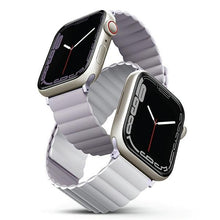 Заредете изображение във визуализатора на галерията – UNIQ pasek Revix Apple Watch Series 4/5/6/7/8/SE/SE2/Ultra 42/44/45mm. Reversible Magnetic lilak-biały/lilac-white - TopMag
