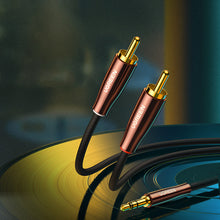 Заредете изображение във визуализатора на галерията – Ugreen cable audio cable 3.5 mm mini jack (male) - 2RCA (male) 2m copper (AV170)
