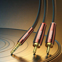 Заредете изображение във визуализатора на галерията – Ugreen cable audio cable 3.5 mm mini jack (male) - 2RCA (male) 2m copper (AV170)
