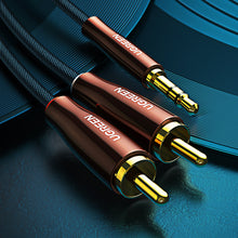 Заредете изображение във визуализатора на галерията – Ugreen cable audio cable 3.5 mm mini jack (male) - 2RCA (male) 2m copper (AV170)
