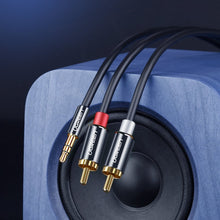 Заредете изображение във визуализатора на галерията – Ugreen audio cable 3.5 mm mini jack - 2RCA 3m black (10590)
