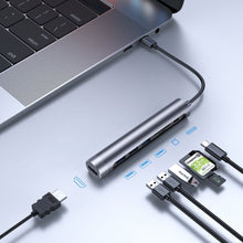 Заредете изображение във визуализатора на галерията – Joyroom Multifunctional USB Hub 7in1 Type C / 3x USB 3.0 / HDMI 4K 30Hz / SD Card Reader and Micro SD 100W 15cm gray (S-H112) - TopMag
