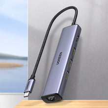 Заредете изображение във визуализатора на галерията – Ugreen adapter converter HUB 5in1 USB C - 3x USB 3.0 / HDMI / RJ45 gray (CM475)

